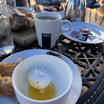Twenty6 - Poached egg. Pastry tray on board in back. - New American Near Me - La Quinta, California Twenty6 - Poached egg. Pastry tray on board in back. - New American Near Me - La Quinta, California