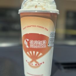 Jasmine milk tea with whipped cream and pecans Jasmine milk tea with whipped cream and pecans