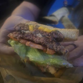 The Wheel - Half and inside of Grilled cheese smash burger - Sports Bars Near Me - Wheeling, West Virginia The Wheel - Half and inside of Grilled cheese smash burger - Sports Bars Near Me - Wheeling, West Virginia