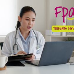 FPA Women's Health - Tulare - A healthcare provider from FPA Women's Health appears on a computer screen during a virtual appointment, wearing a white coat.