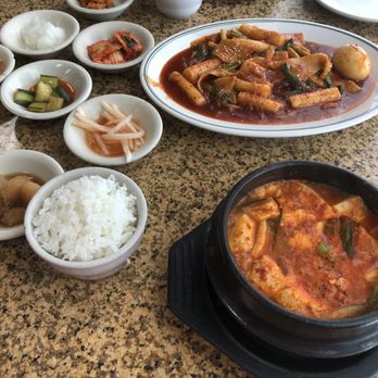 Korean Grill - Seafood soft tofu soup with rice, Spicy rice cake and side dishes - Korean Near Me - Austin, Texas