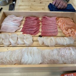 Table setting, waygyu, and sushi omakase