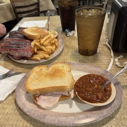 Akins Bar-B Q & Grill - 1/2 rack of ribs French fries and macaroni and cheese with garlic bread. Sliced turkey on garlic bread with baked beans.