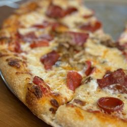 Husick’s By Forester - Wife was hangry so took the picture of only half of the Meat Lover's pizza