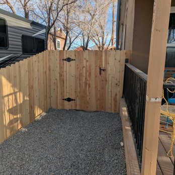 Blue Dog Contracting - Step up from 4 foot to 6 foot cedar fence and gate to back yar - General Contractors Near Me