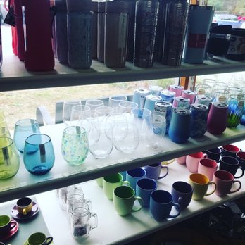 Atlantic Spice Co - a shelf full of colorful glassware - Coffee & Tea Near Me - North Truro, Massachusetts