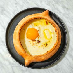 Chito Gvrito NYC - Open-faced cheese pie with a farm egg and local butter - mix and enjoy this iconic Georgian dish for two :)