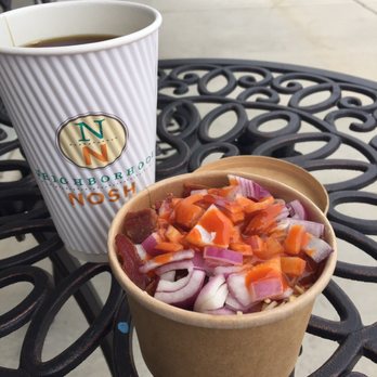 Neighborhood Nosh - a cup of coffee and a bowl of chopped vegetables - Beer, Wine & Spirits Near Me - McKinney, Texas