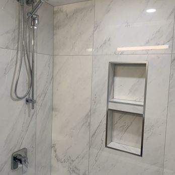 Huard Custom Stone and Tile - 24x48 porcelain marble looking tiles . - Fireplace Services Near Me Huard Custom Stone and Tile - 24x48 porcelain marble looking tiles . - Fireplace Services Near Me