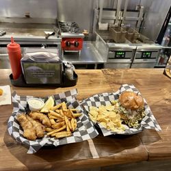 Buckboard Bar - Fried fish and olive burger