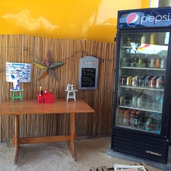 Keys Cuisine - a table with a beverage cooler in the background - Street Vendors Near Me - Key West, Florida