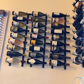 Bin 39 - Wine racks hang around the room displaying some yummy wines. - Wine Bars Near Me - St. Augustine, Florida