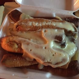 Breadsticks with cheese on top. Breadsticks with cheese on top.
