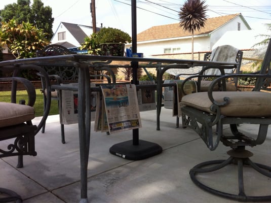 Photo of The Orange County Register - Irvine, CA, US. Our paper on the drying racks before we can read it ... and after we gather the pages that eventually blow all over our yard.