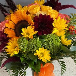 Beautiful orange and yellow flower arrangement. Absolutely stunning!