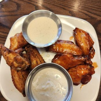 Burtons Grill & Bar - Signature Wings ( 1/2 maple sriracha;  1/2 dry rub) - New American Near Me - Richmond, Virginia