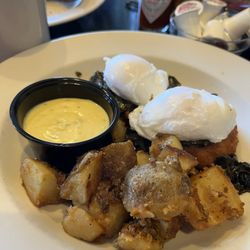 Leon's Cafe & Catering - Grits and greens Benedict special is super yummy