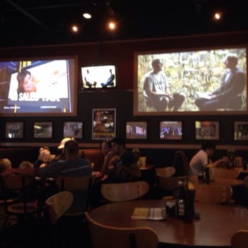 Buffalo Wild Wings - people sitting at tables watching televisions - Chicken Wings Near Me - Port Huron Charter Township, Michigan Buffalo Wild Wings - people sitting at tables watching televisions - Chicken Wings Near Me - Port Huron Charter Township, Michigan