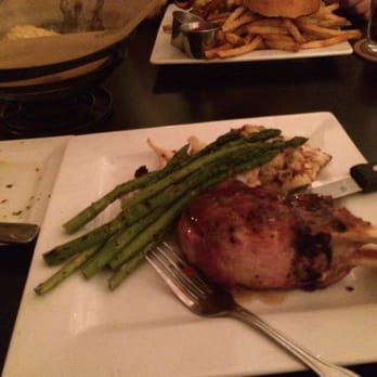 TapRoot - Drunken Pork chop, roasted cauliflower and asparagus - New American Near Me - Decatur, Illinois