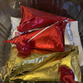 Radhe Paanwala - a plastic container filled with candy - Tobacco Shops Near Me - Edison, New Jersey