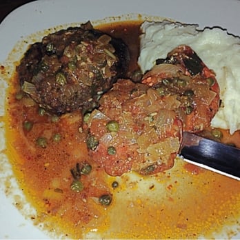 Folklore Argentine Grill - Mar Y Tierra - grilled 8 oz filet mignon and two jumbo fresh water shrimp sautéed with capers in a tomato-basil sauce - Argentine Near Me - Chicago, Illinois Folklore Argentine Grill - Mar Y Tierra - grilled 8 oz filet mignon and two jumbo fresh water shrimp sautéed with capers in a tomato-basil sauce - Argentine Near Me - Chicago, Illinois