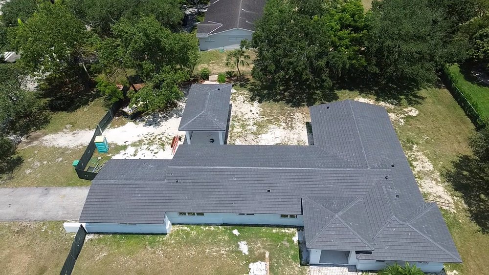 Slide of MC Roofing Service