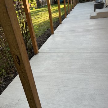 J Montoya Construction Corp - a concrete patio with wood posts - General Contractors Near Me - Skokie, Illinois