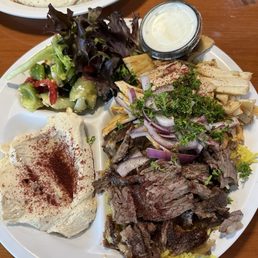 Dinner special with half beef and half chicken shawarma. Dinner special with half beef and half chicken shawarma.