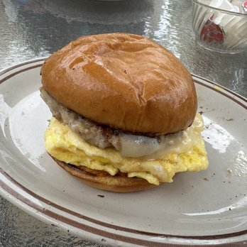 Hi Tulip Cafe - BYO Breakfast Sandwich- scrambled eggs, sausage patty, swiss cheese on a brioche bun - American Near Me - Flagler Beach, Florida Hi Tulip Cafe - BYO Breakfast Sandwich- scrambled eggs, sausage patty, swiss cheese on a brioche bun - American Near Me - Flagler Beach, Florida