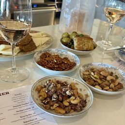 Spiced pretzels, salted nuts, candied nuts, mixed olives, manchego cheese, coppa, and rose! What more could a girl ask for?