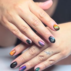 Mairbear Nail Studio - Structured manicure with chrome, cat eye polish, and hand painted snakes.