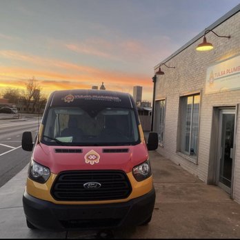 Tulsa Plumbing and Remodeling - a van parked in front of a building - Plumbing Near Me - Tulsa, Oklahoma