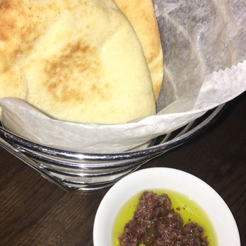 Agora DC - The pita bread, comes out fresh and warm! Served with olive oil with fresh olives (I usually dislike eating olives but these were tasty!) - Mediterranean Near Me - Washington, DC, District of Columbia