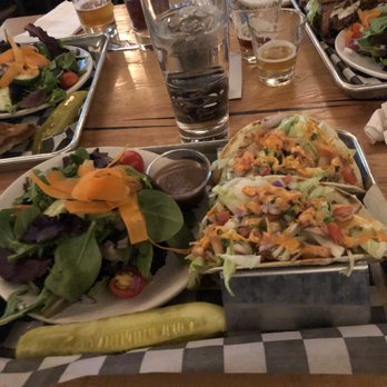 Restaurant at Smuttynose - In front: Chicken Tacos ; Side Salad  To the Right: FindestKind Burger - New American Near Me - Hampton, New Hampshire