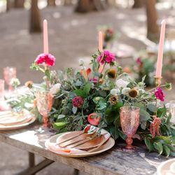 The Wandering Bride - An up close view of the picnic table set up at a Wedding reception brunch at Cathedral Beach