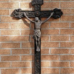 Our Lady of Mount Carmel - A Crucifix on the side of the Church – representing Jesus Christ giving Himself for our sins and thus, uniting us with God the Father.