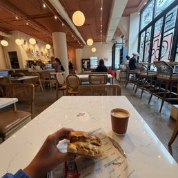 Cappuccino and breakfast sandwich Cappuccino and breakfast sandwich