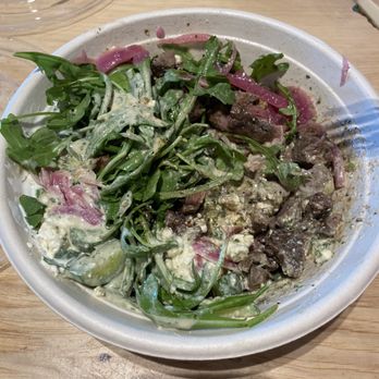 CAVA - Build your own bowl - Arugula, steak, tzatziki, pickled red onion, feta cheese, cucumber, steak, lemon tahini sauce. - Salad Near Me - Franklin, Tennessee
