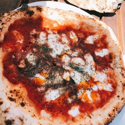 Come for the city view and impressed by the pizza
