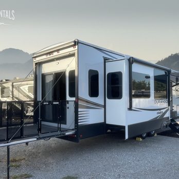 Double S Rentals - Talk about luxury! Check out the Durango with a 4 slide-outs, a fold-out patio, private office, outdoor TV, loft area & residential kitchen! - RV Rental Near Me