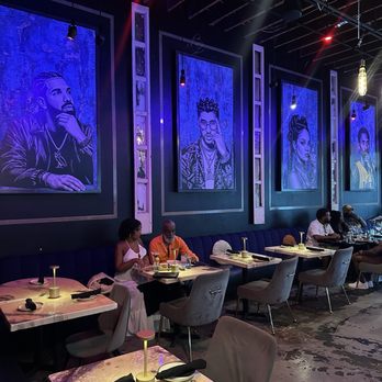 Bello Bar Plus Kitchen - Beautiful seating including wall murals of Drake, Bad Bunny, Rhianna, and Kobe Bryant RIP - Lounges Near Me - Tampa, Florida Bello Bar Plus Kitchen - Beautiful seating including wall murals of Drake, Bad Bunny, Rhianna, and Kobe Bryant RIP - Lounges Near Me - Tampa, Florida