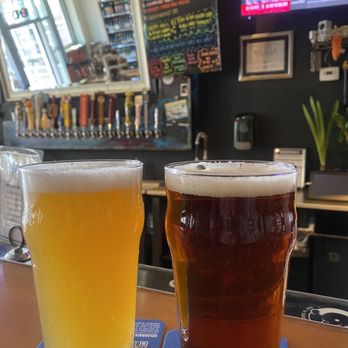 Pay-N-Take - ows two glasses of beer on a bar - Wine Bars Near Me - Flagstaff, Arizona