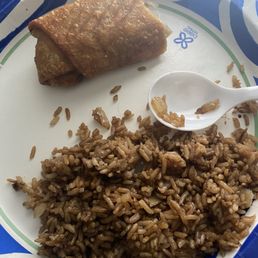 Cheesesteak Egg Rolls - Fried rice with a spring roll and a white spoon on a blue and white tray, served at Sun Wah restaurant in Baltimore, MD.