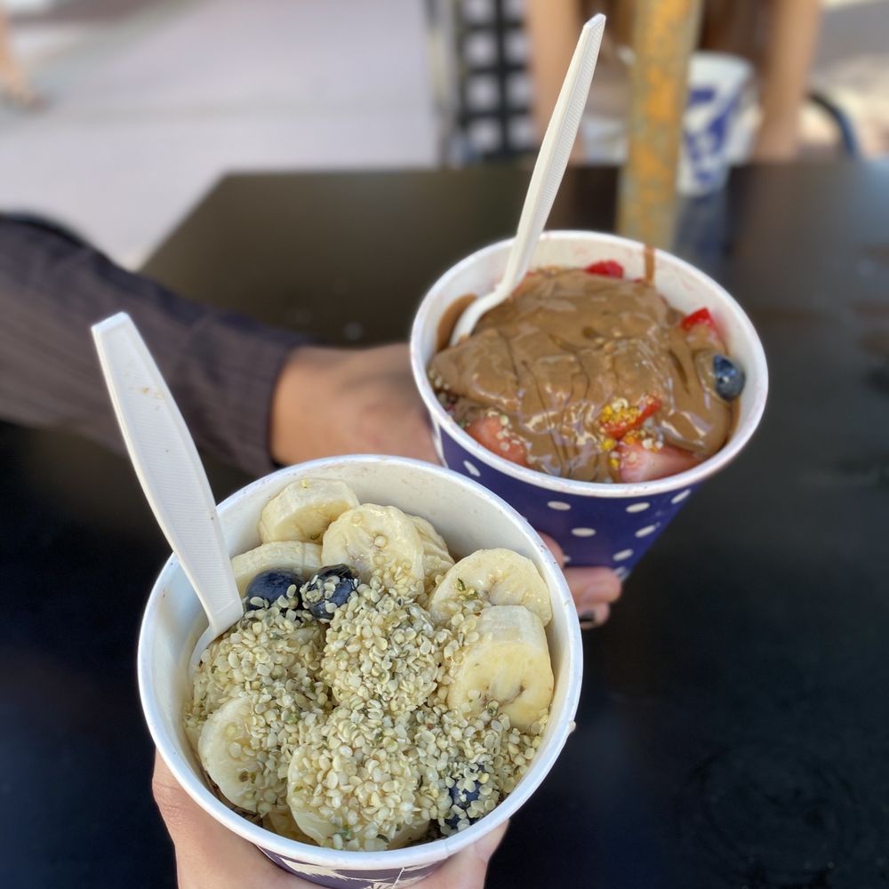 a person holding a bowl of food a person holding a bowl of food