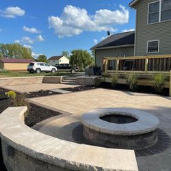 Oakscapes - Paver patio, seating wall, fire pit, retaining wall with steps.