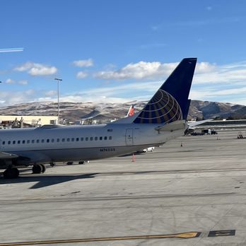 Escape Lounges - The Centurion Studio Partner RNO - View from the Escape lounge. An airplane, the mountains and blue skies. - Airport Lounges Near Me - Reno, Nevada Escape Lounges - The Centurion Studio Partner RNO - View from the Escape lounge. An airplane, the mountains and blue skies. - Airport Lounges Near Me - Reno, Nevada