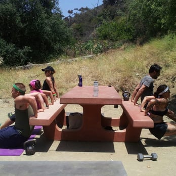 Runyon Canyon Bootcamp - A high-intensity round of tricep dips on the picnic benches. "Runyon Canyon Bootcamp" on facebook - Trainers Near Me - Hollywood, California