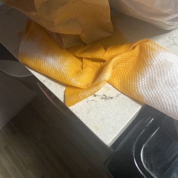Kare Thai - Wiping up the spilled tea leaking from the bag - Thai Near Me - New York, New York