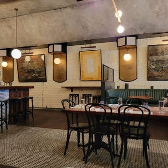 Oliver Royale - a dining area with tables and chairs - New American Near Me - Knoxville, Tennessee Oliver Royale - a dining area with tables and chairs - New American Near Me - Knoxville, Tennessee