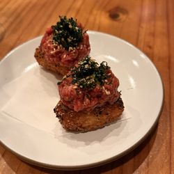 Oken - YUKHWE ONIGIRI - two piece crispy rice, beef tartare, quail egg, perilla $17
